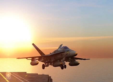 Military aircraft taking off from an aircraft carrier