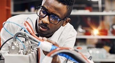 An engineer develops a solution for a customer requirement.