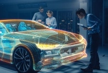 Engineers in an automotive design lab analyze an EV for battery connectivity.