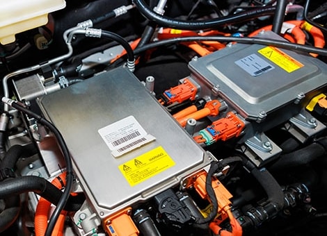 Closeup of an EV battery in an electric car engine.