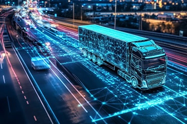 A data-connected smart truck on a highway at night.