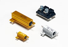 Variety of precision and power chassis mount resistors on a white background