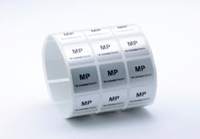 Roll of polyester labels on a white background