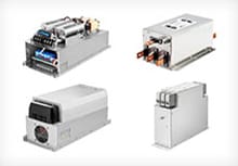 Variety of Schaffner EMC/EMI three-phase filters on a white background